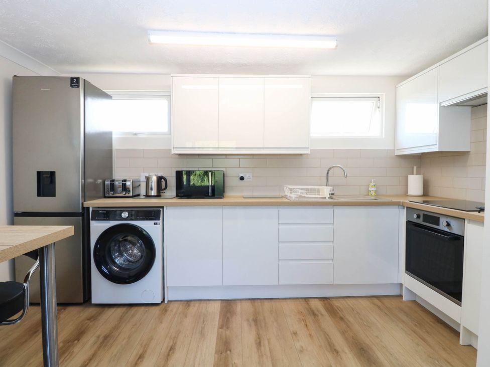 A kitchen with appliances and a countertop at 158 Beach Road Chalet Park
