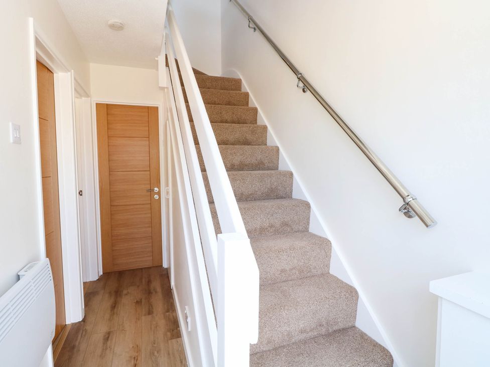 A staircase in a hallway at 158 Beach Road Chalet Park