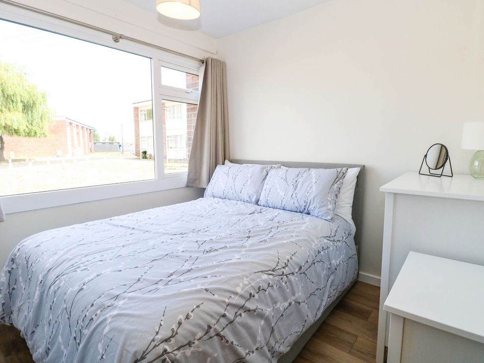 A bedroom with a bed and nightstand at 158 Beach Road Chalet Park