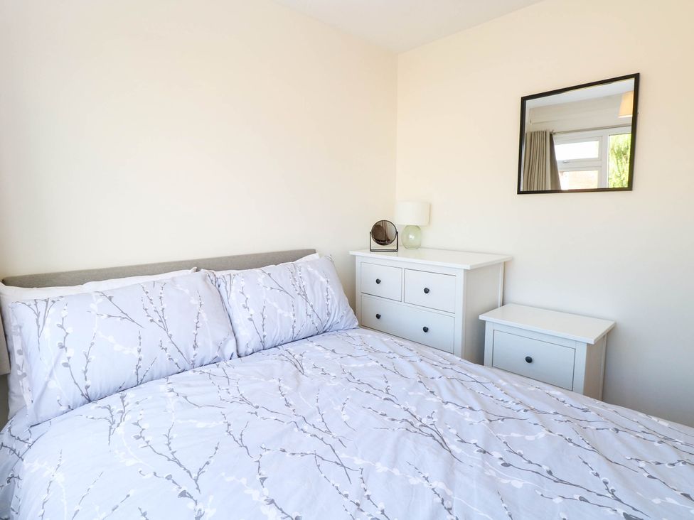 A bedroom with a bed and dresser at 158 Beach Road Chalet Park