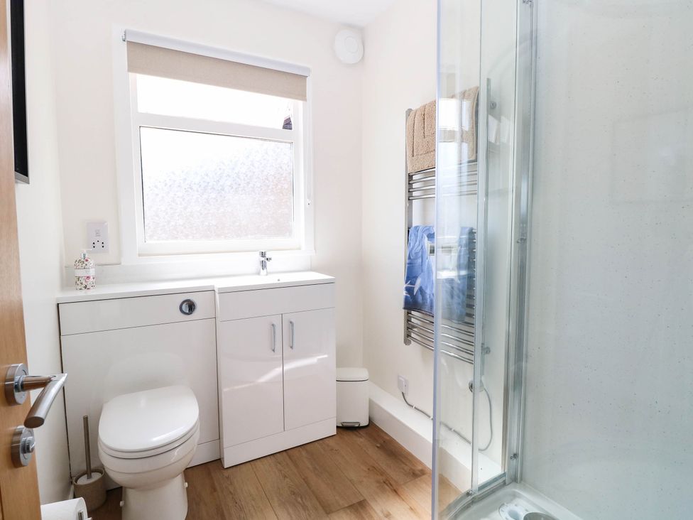 A bathroom with a shower and sink at 158 Beach Road Chalet Park