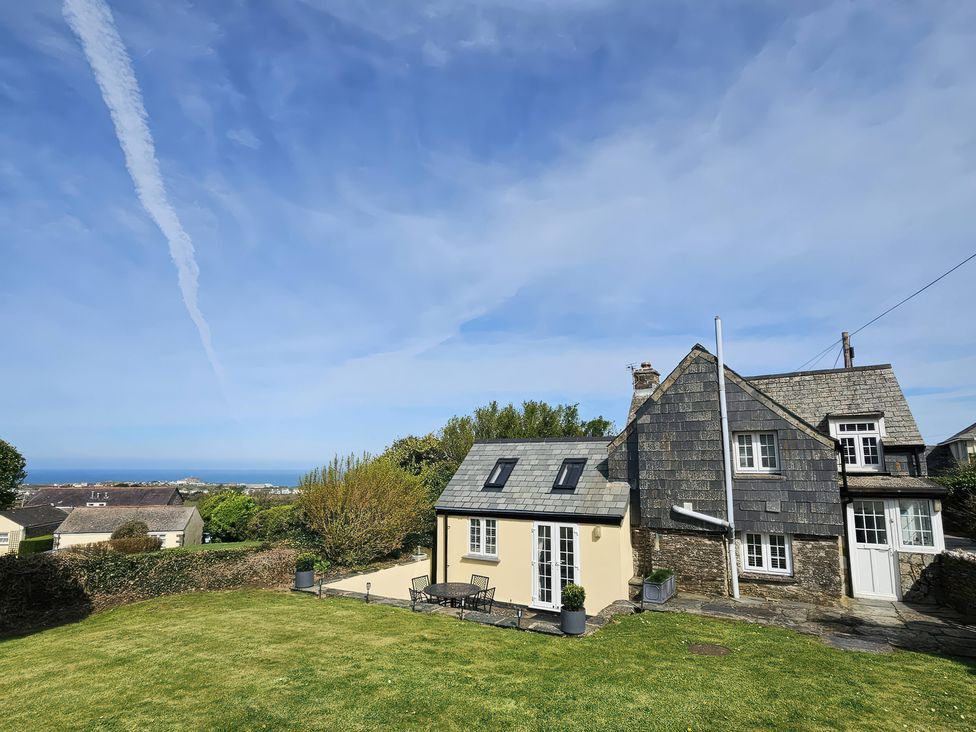 A house with a slate roof and garden at Ivy Cottage in Trenale near Tintagel