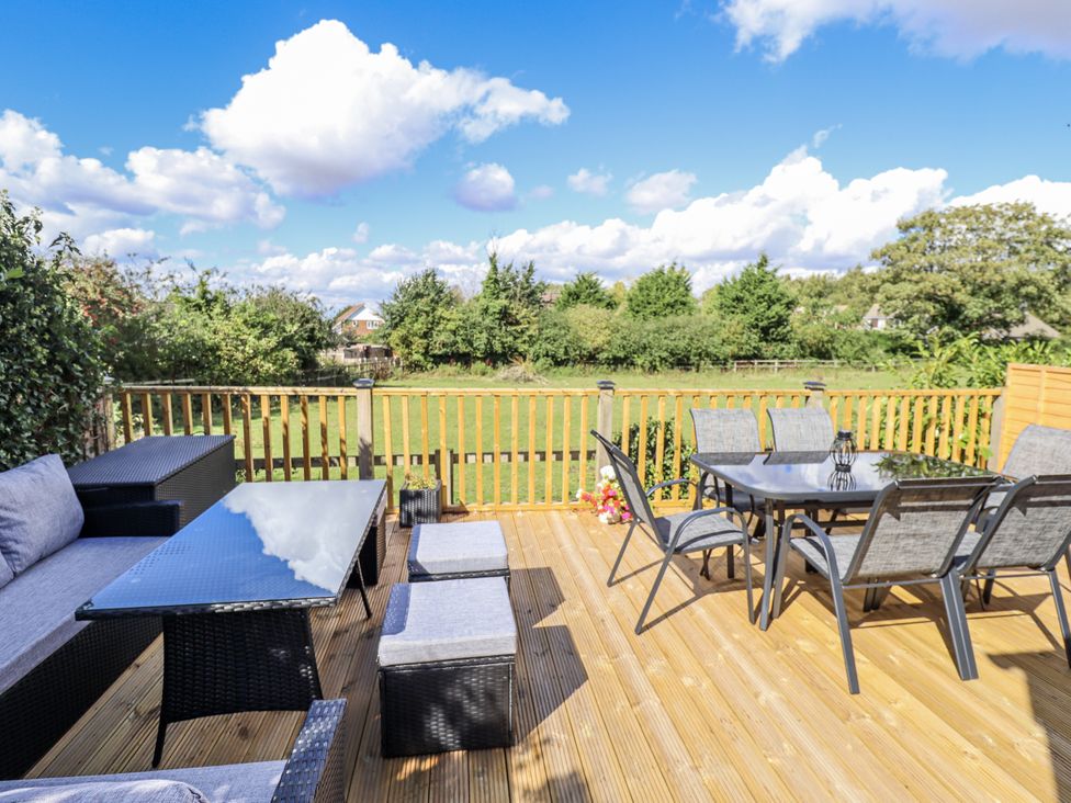 An outdoor seating area with table and chairs at Church View in Withernwick near Aldbrough