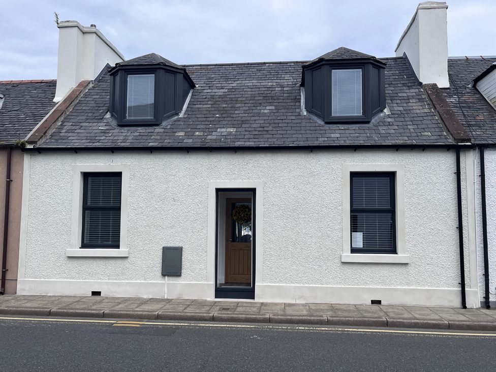 A house with a front door and windows at Beach House in Stranraer
