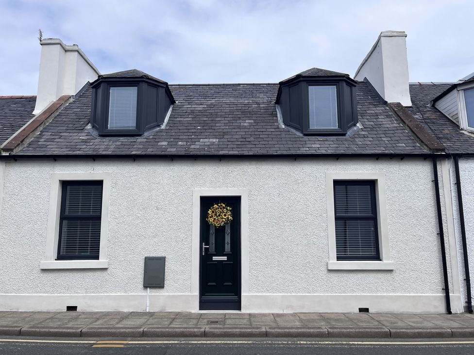 A house with a door and windows at Beach House in Stranraer