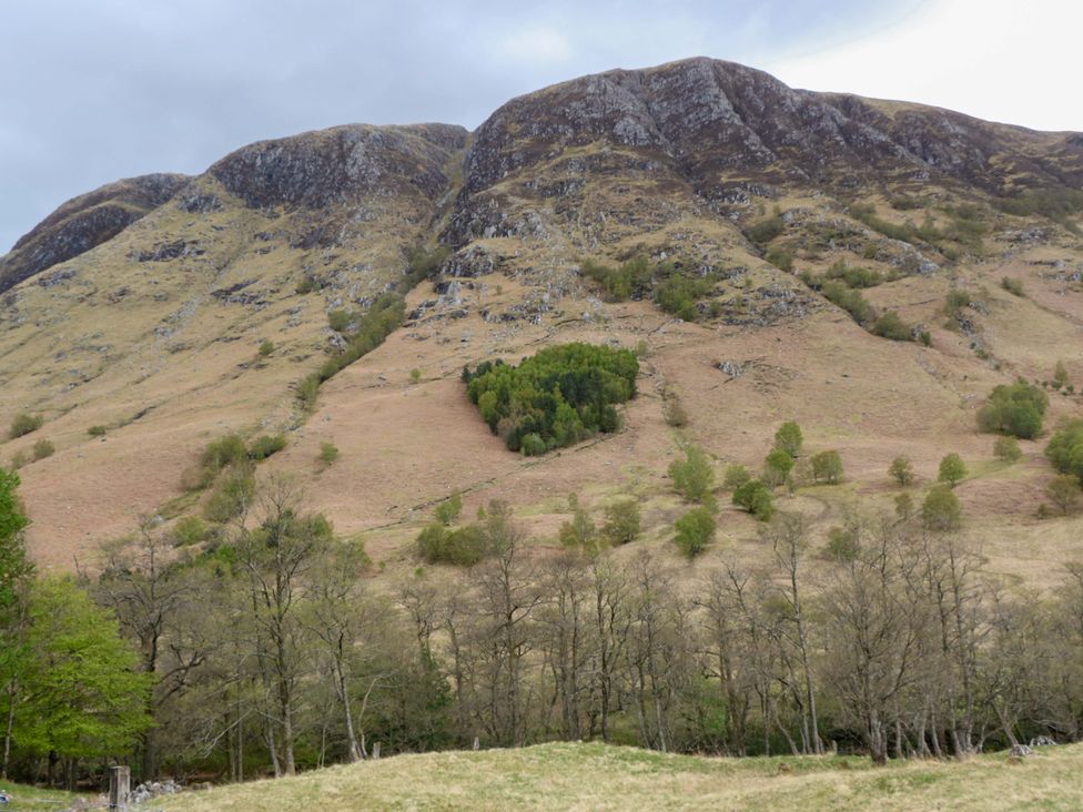 A landscape view of hills and trees at Nevis Bridge House in Fort William