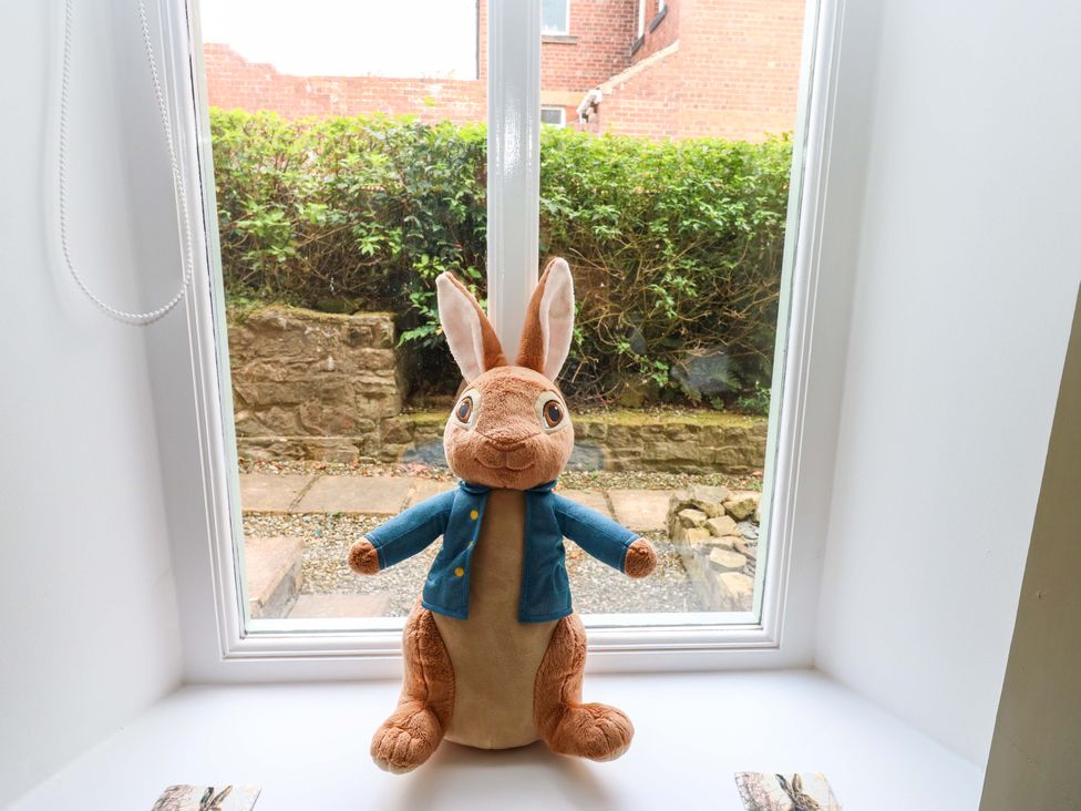 A plush toy rabbit by a window at The Miners Hall Retreat in Stanley, County Durham