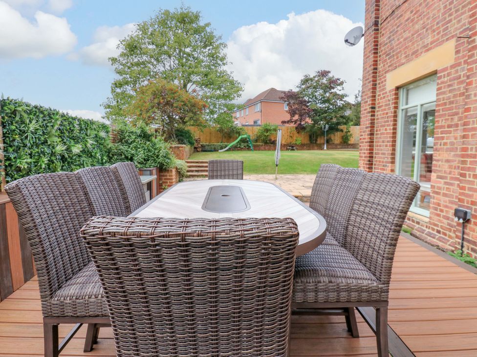 An outdoor dining area with a table and chairs at The Miners Hall Retreat in Stanley, County Durham