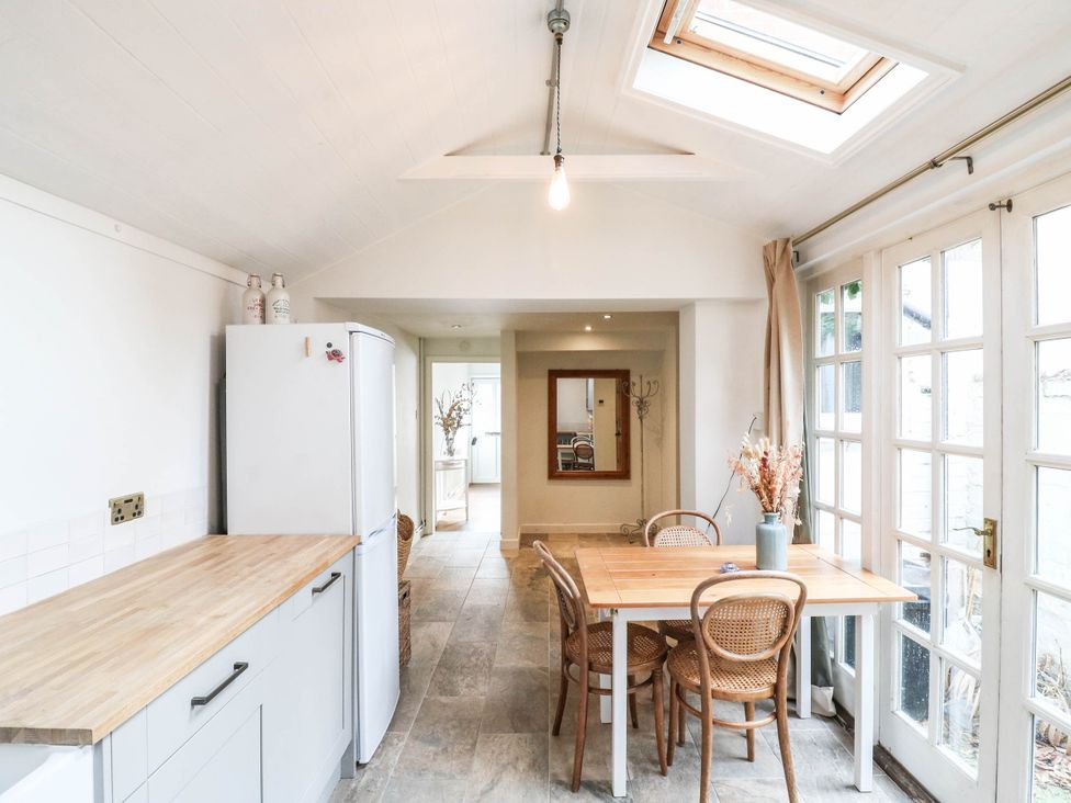 A kitchen with a table and chairs at 5 Prospect Place in Woodbridge