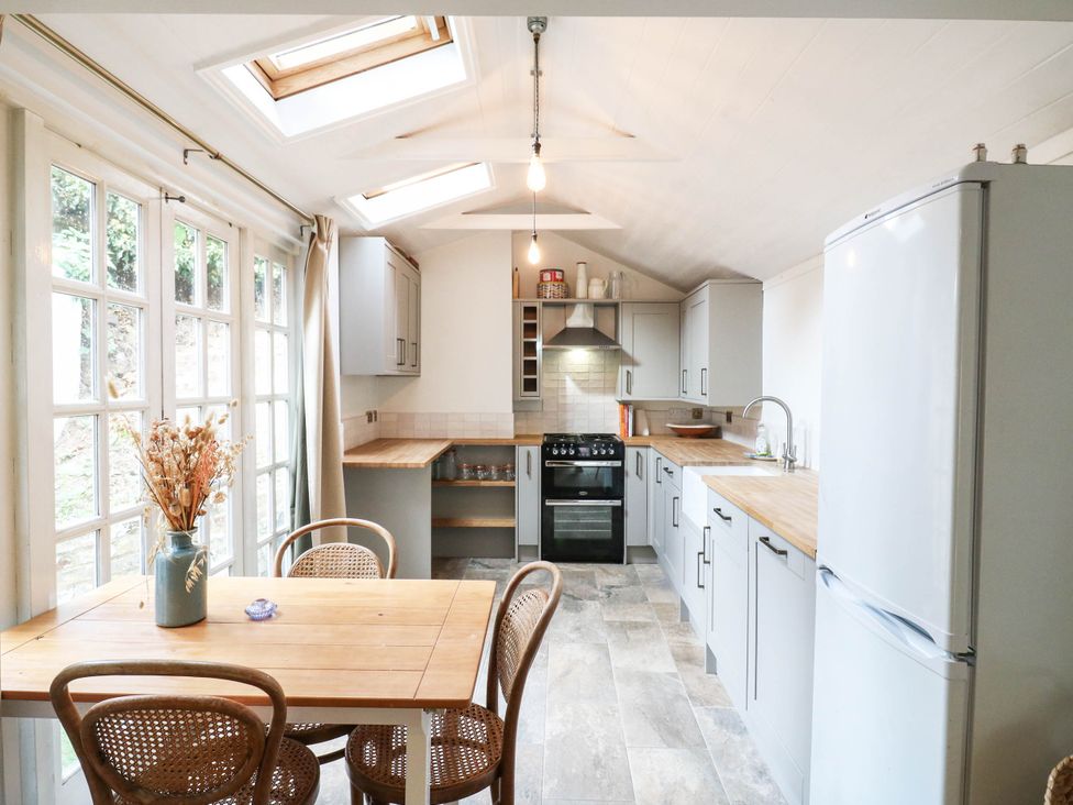 A kitchen with a table and chairs at 5 Prospect Place in Woodbridge