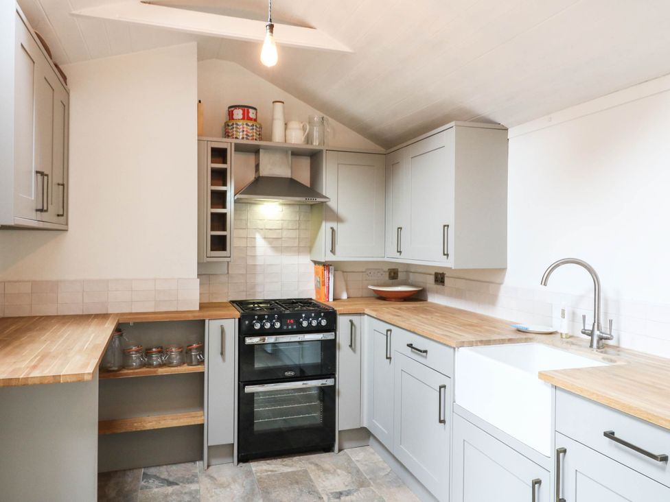 A kitchen with a stove and sink at 5 Prospect Place in Woodbridge