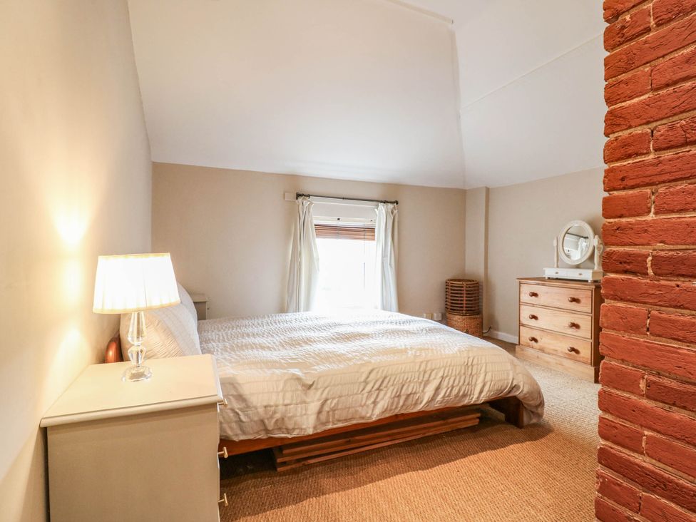 A bedroom with a bed and dresser at 5 Prospect Place in Woodbridge