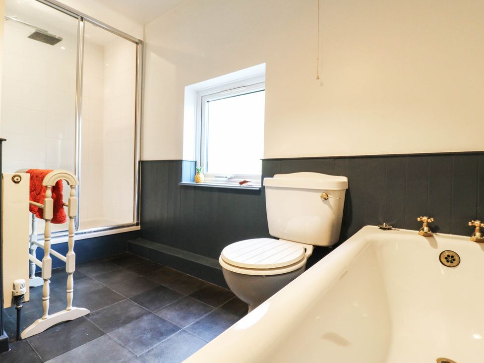 A bathroom featuring a bathtub, shower, and toilet at 5 Prospect Place in Woodbridge