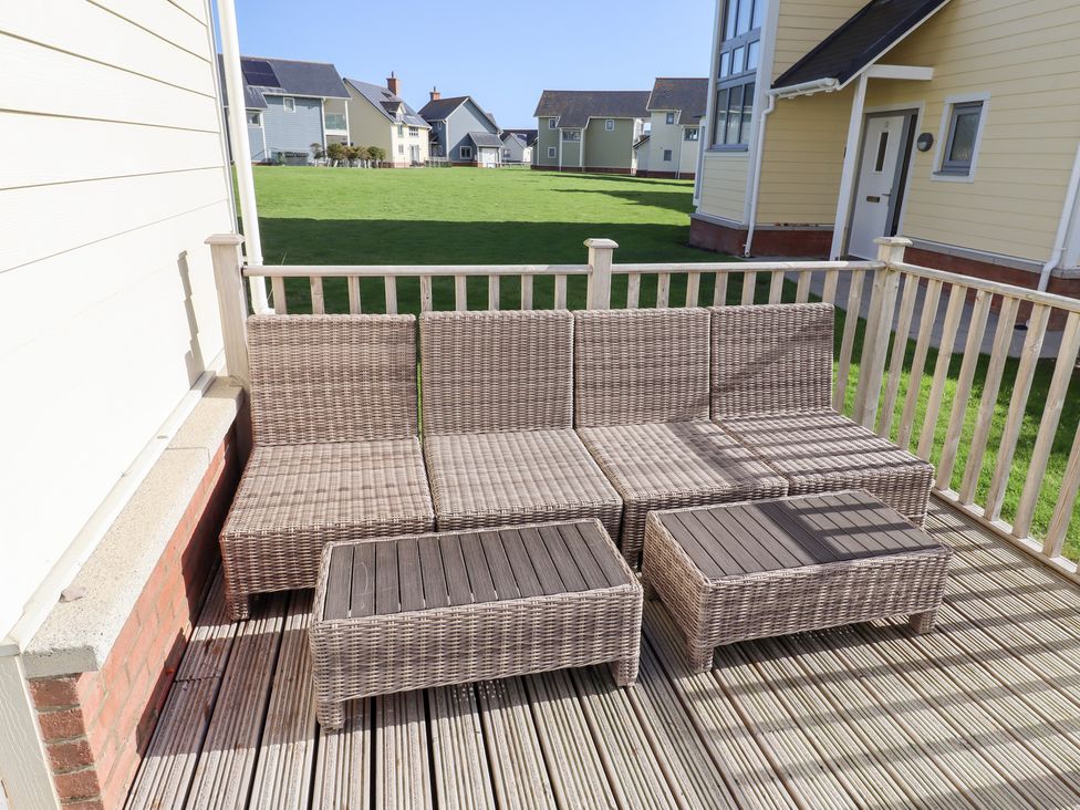 A sofa and coffee table on a deck at The Beach House (Beadnell)