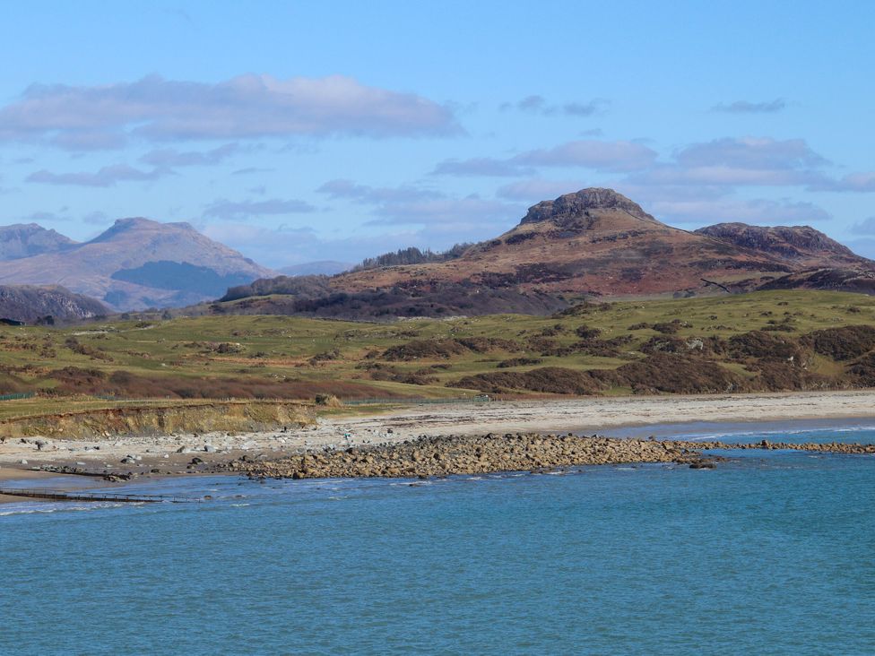 A view of shoreline and hills at Bryn Caled in Llanarmon near Y Ffor