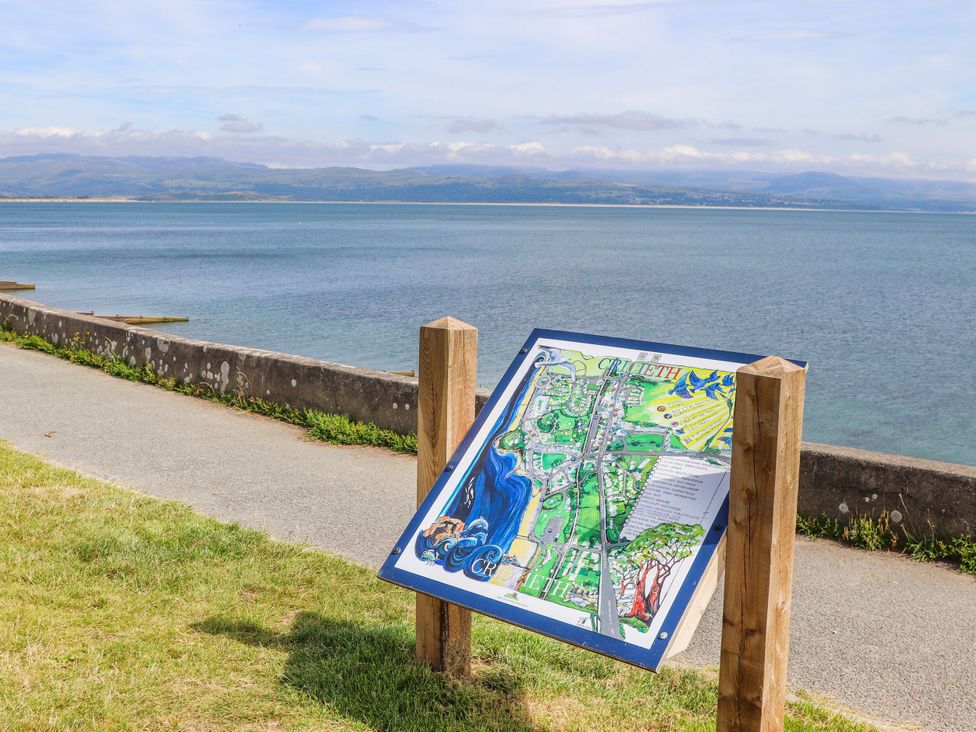 A map sign along a path by the sea at Bryn Caled Llanarmon near Y Ffor