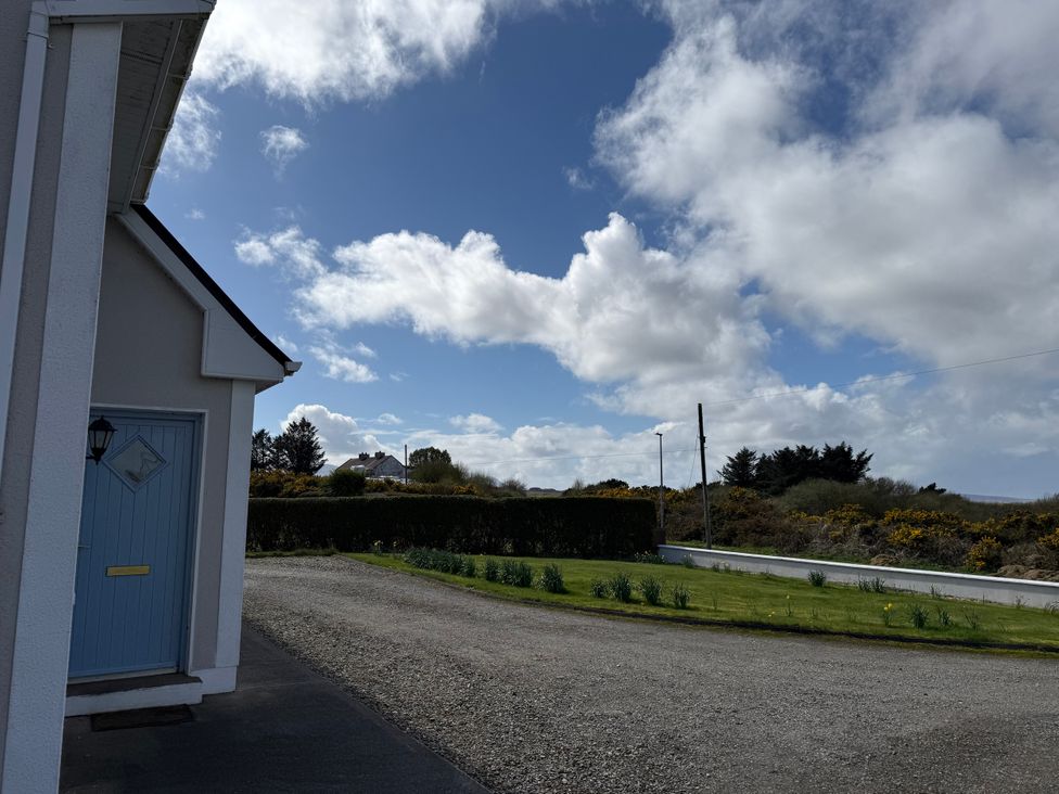 A view of the outdoor space with a door and pathway at Geesala