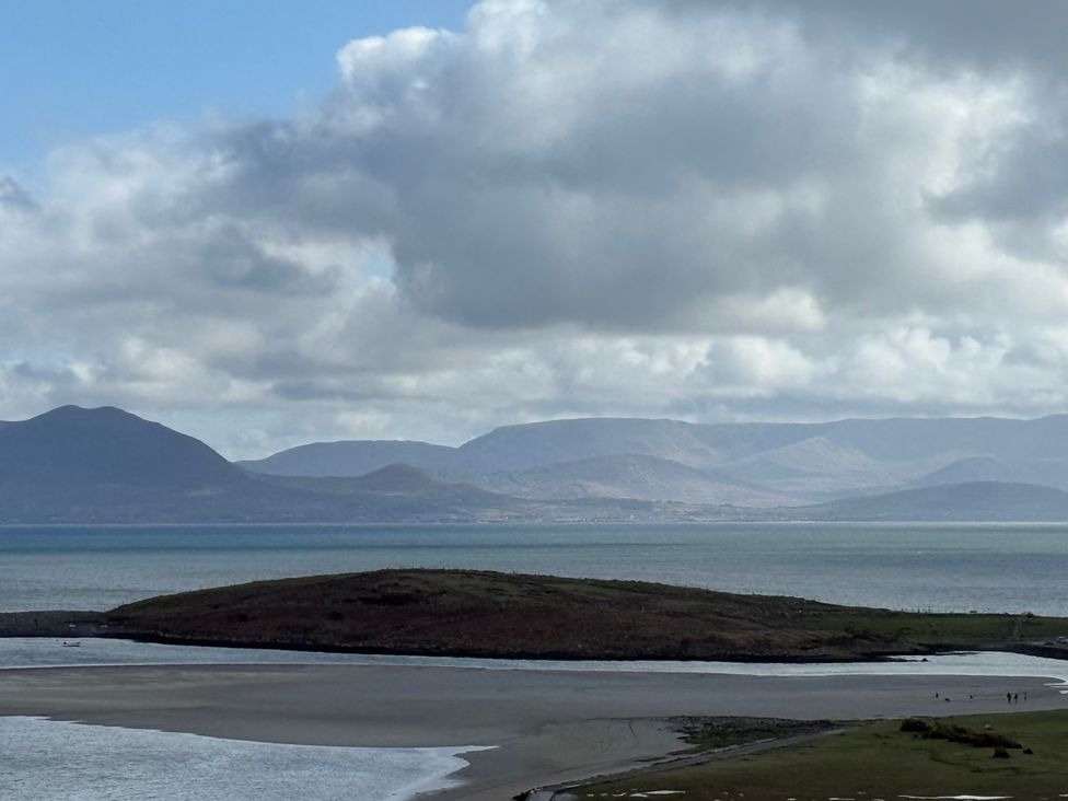 A view of mountains and water with an island at Geesala