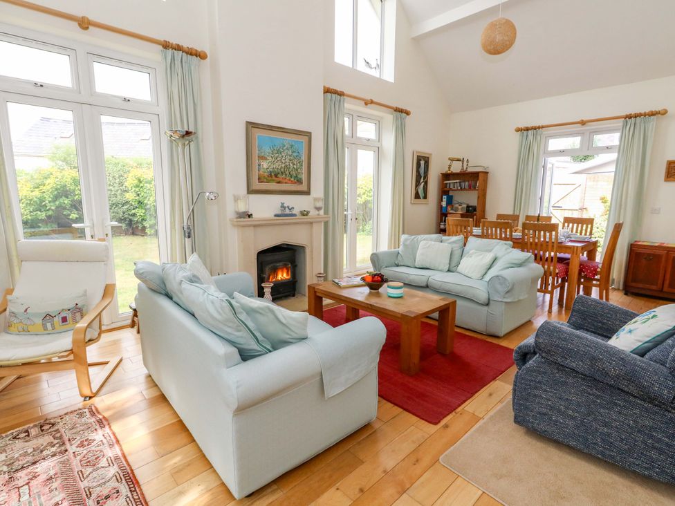 A living room with a coffee table and sofas at 1 Fernhill Avenue Weymouth