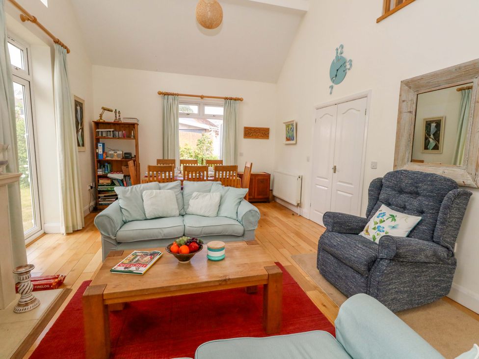 A living room with a sofa and coffee table at 1 Fernhill Avenue, Weymouth