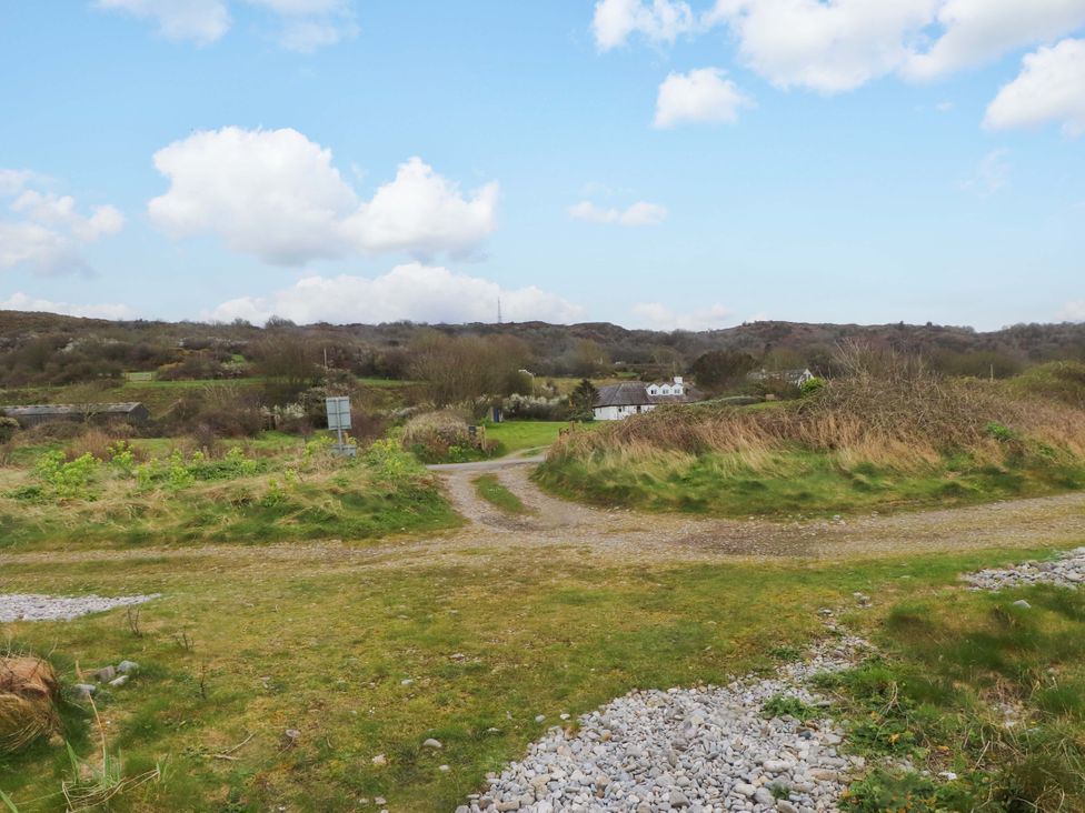 An outdoor landscape with a path and greenery at Belan Wen in Llanddona near Pentraeth
