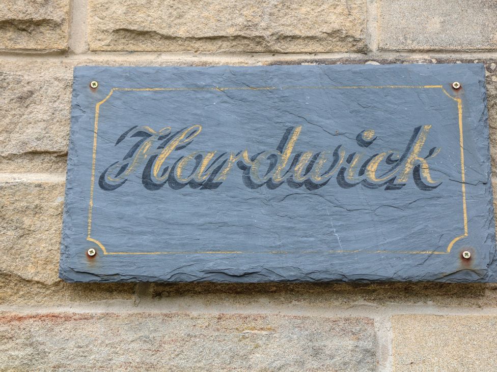 A plaque on a stone wall at Hardwick in Darley Moor near Two Dales