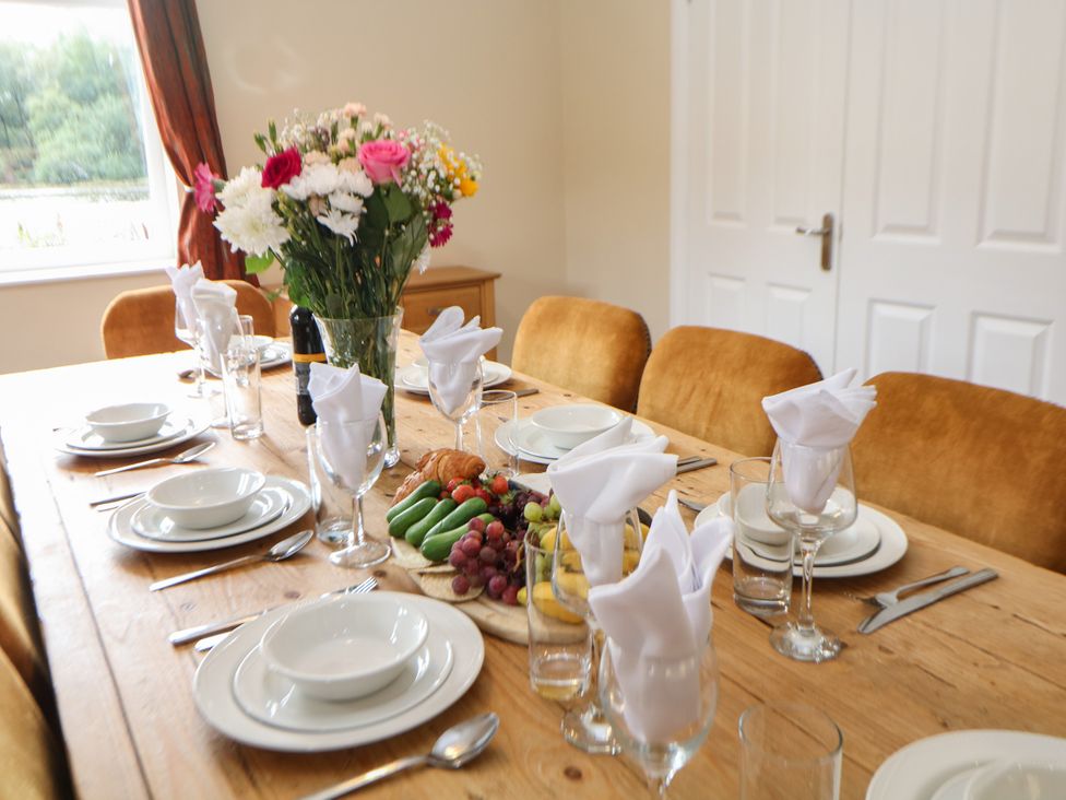 A dining room with a table set for dinner at Hardwick in Darley Moor near Two Dales