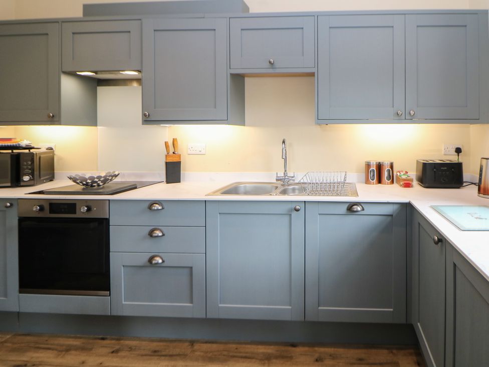 A kitchen with cabinets and appliances at Hardwick in Darley Moor near Two Dales