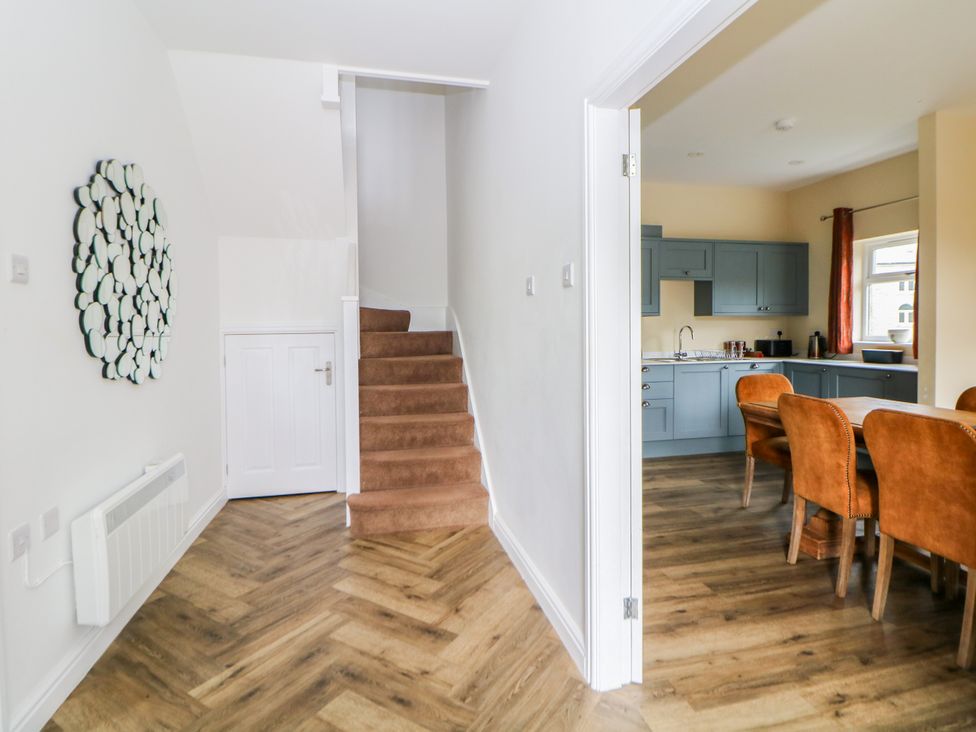 A hallway with staircase and kitchen visible at Hardwick Darley Moor near Two Dales