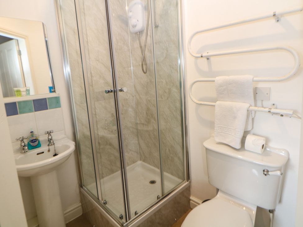 A bathroom featuring a shower, sink, and toilet at Hardwick in Darley Moor near Two Dales