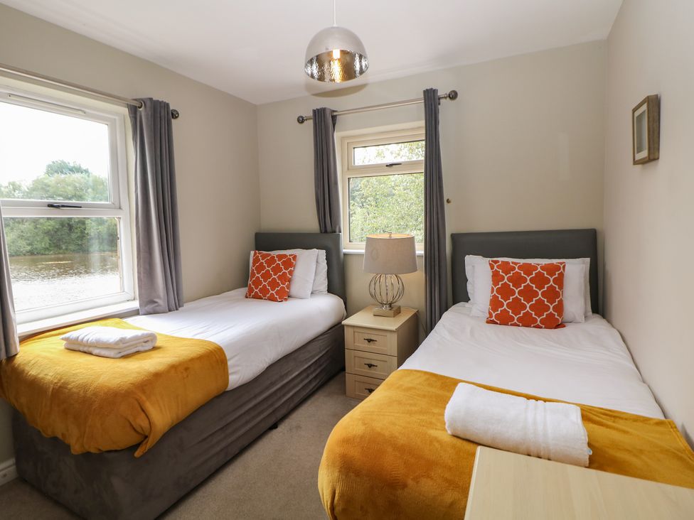 A bedroom with two single beds at Hardwick in Darley Moor near Two Dales