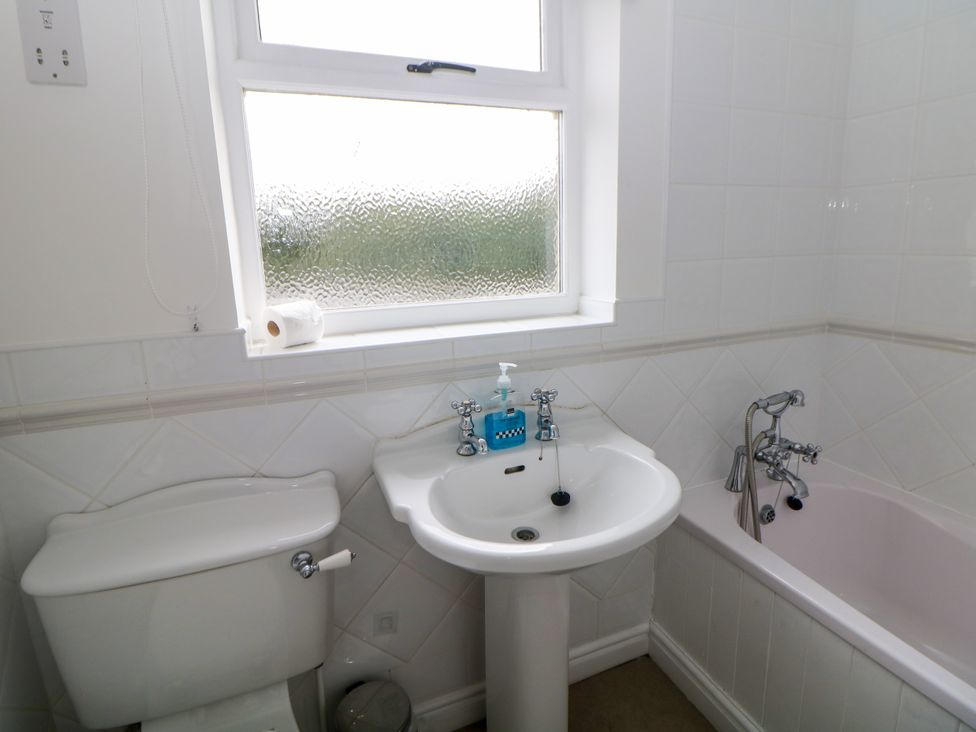 A bathroom with a sink bathtub and toilet at Hardwick in Darley Moor near Two Dales