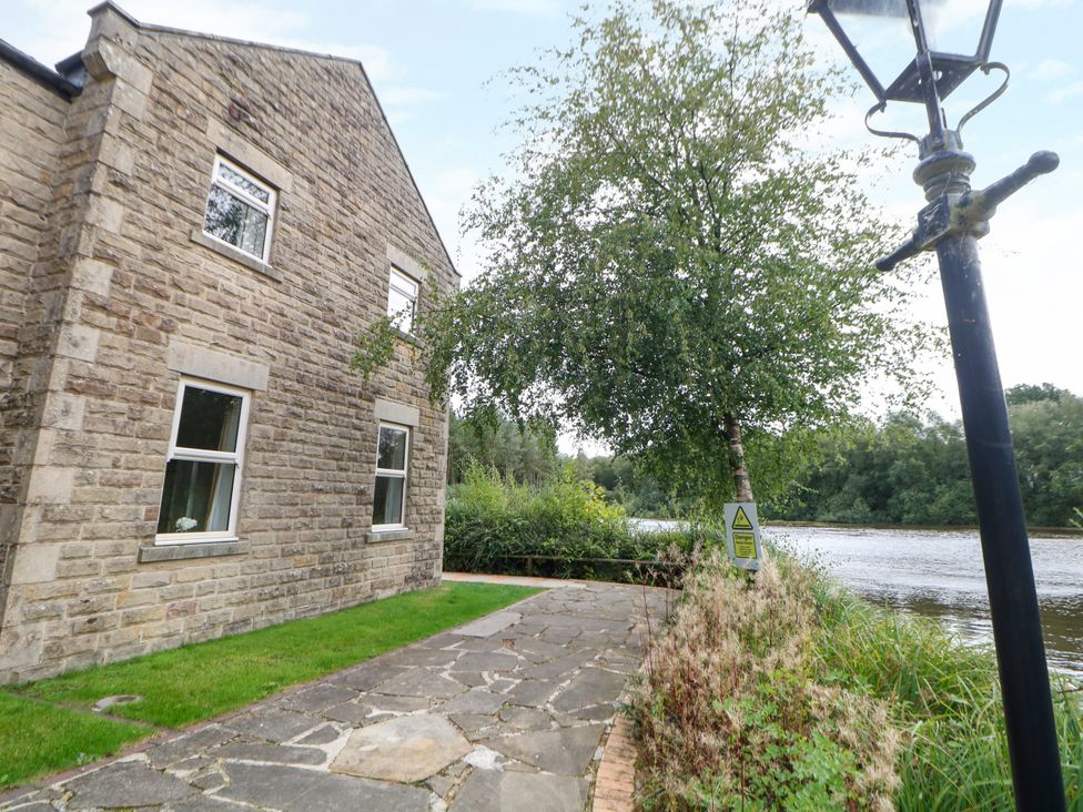 An outdoor area with a stone pathway and a tree at Hardwick, Darley Moor near Two Dales