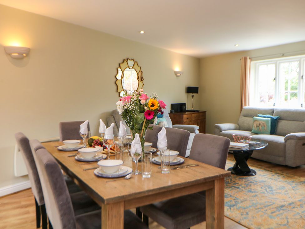 A dining room with a table set for a meal at Hartington near Two Dales