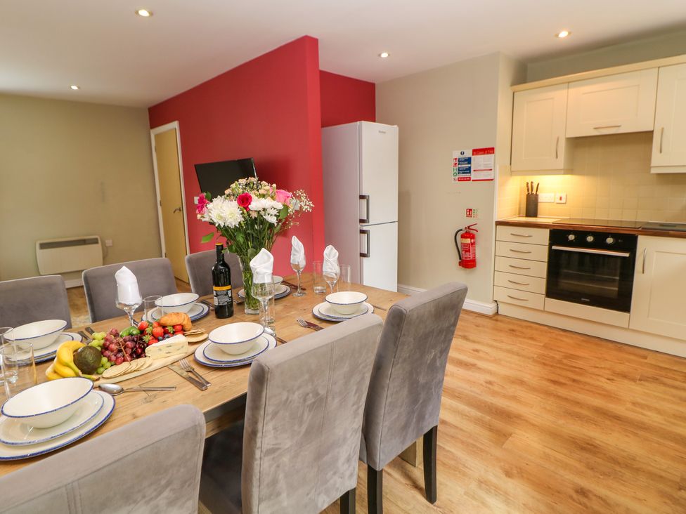 A dining room with a table set for dinner at Hartington in Darley Moor near Two Dales
