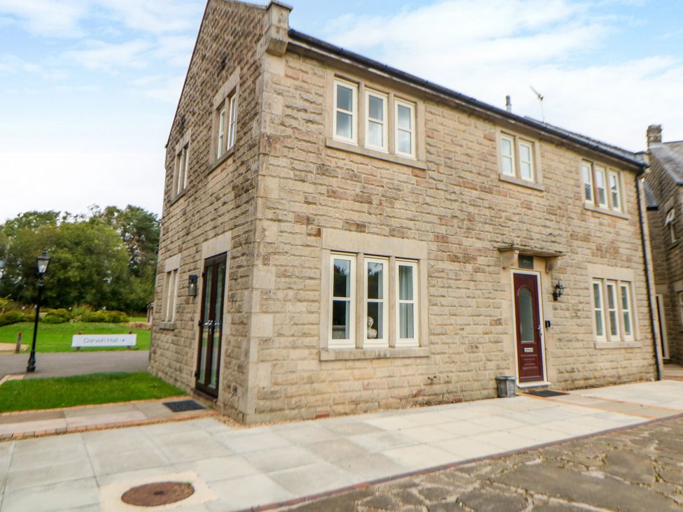 A building exterior with windows and a door at Riber Darley Moor near Two Dales