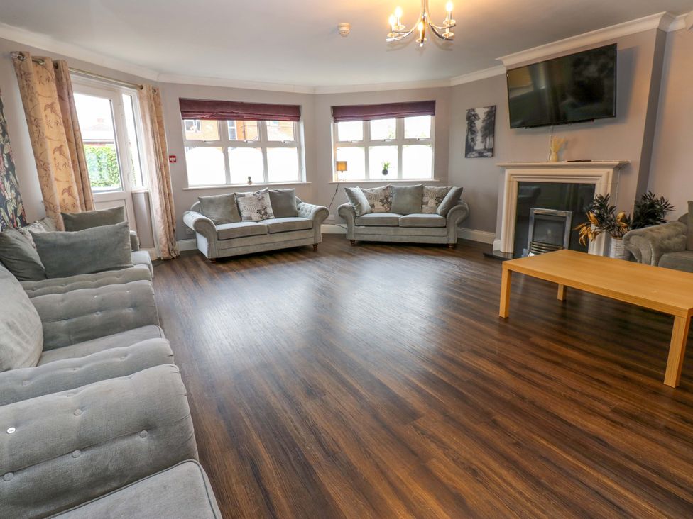A living room with a sofa and coffee table at Fern Lee in Carlisle