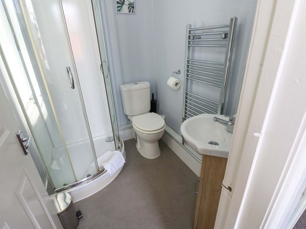 A bathroom with shower, toilet, and sink at Fern Lee in Carlisle