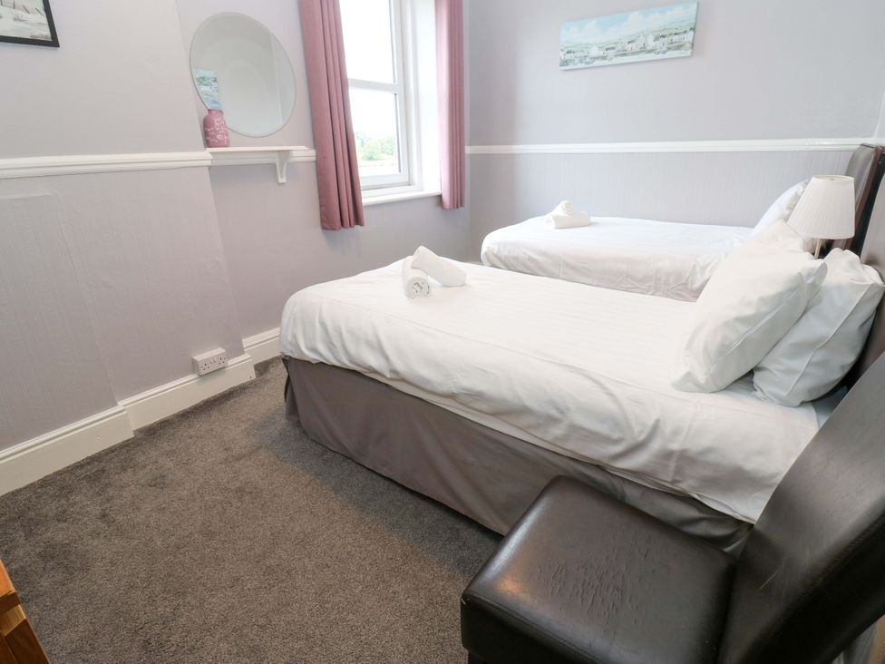 A bedroom with twin beds and a window at Fern Lee in Carlisle
