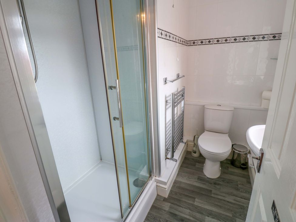 A bathroom with a shower and toilet at Fern Lee in Carlisle