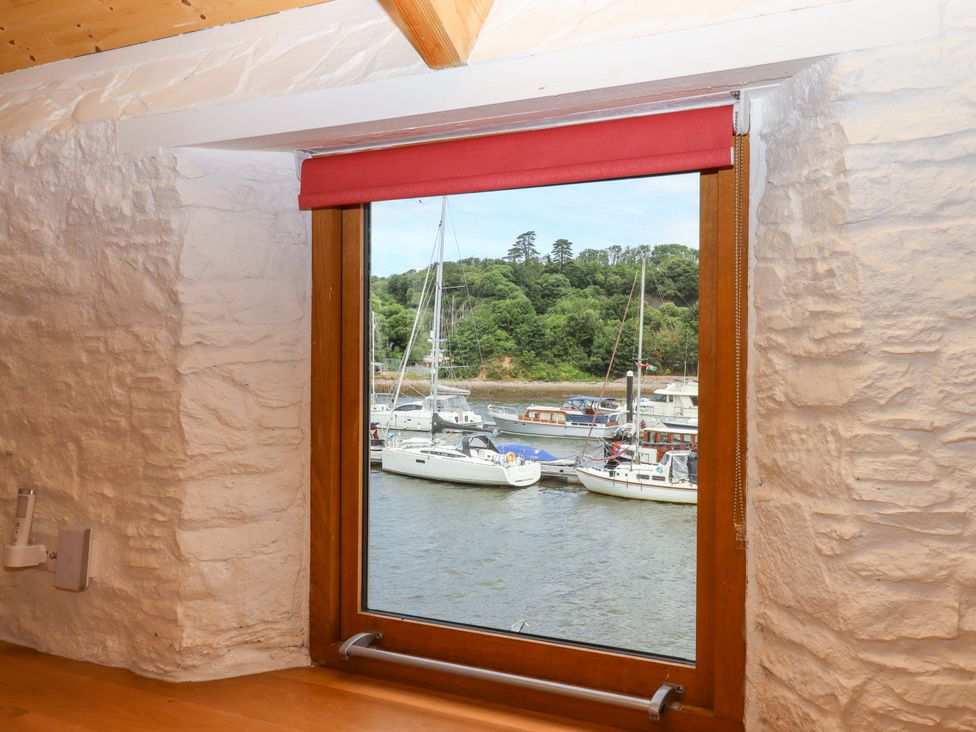 A window with a view of boats on water at Dolphin Cottage in Brixham