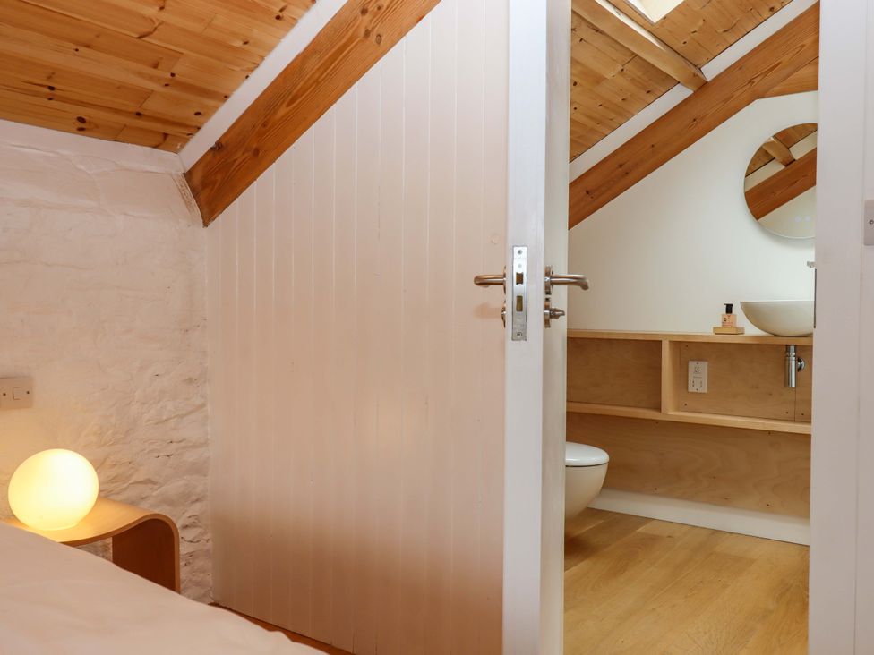 A bathroom with a sink and toilet at Dolphin Cottage in Brixham