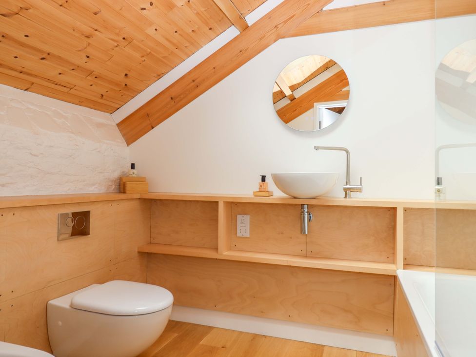 A bathroom with a toilet and sink at Dolphin Cottage in Brixham