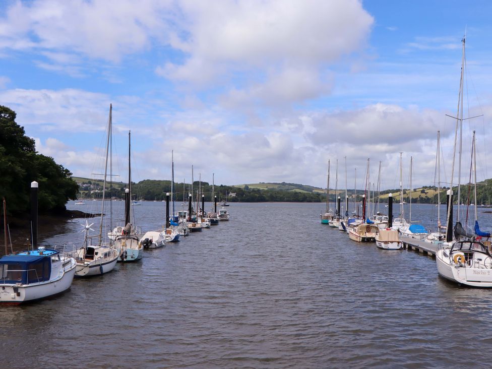 A view of boats docked on water at Dolphin Cottage in Brixham