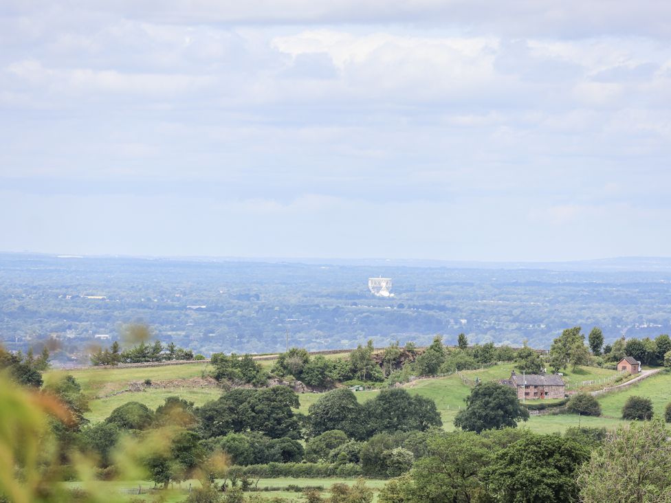 A landscape view with greenery and houses at Fern Cottage in Biddulph