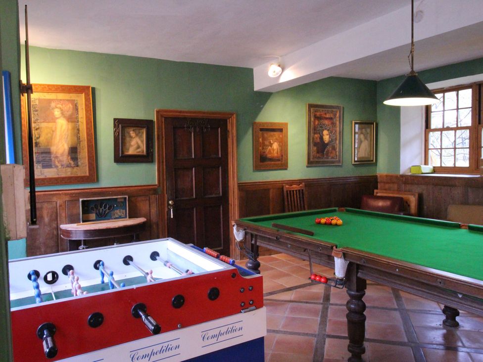 A game room with a foosball table and pool table at Lower Mill in Dittisham