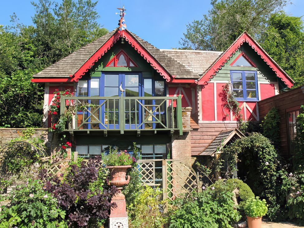 A house with a balcony and garden at The Folly in Dittisham