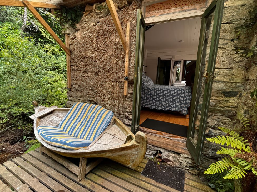 An outdoor area with a boat seat at The Folly in Dittisham