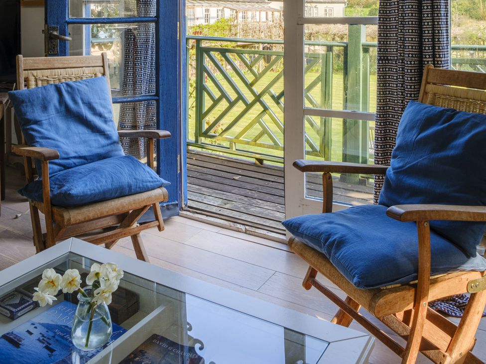 A living room with chairs and a table at The Folly in Dittisham