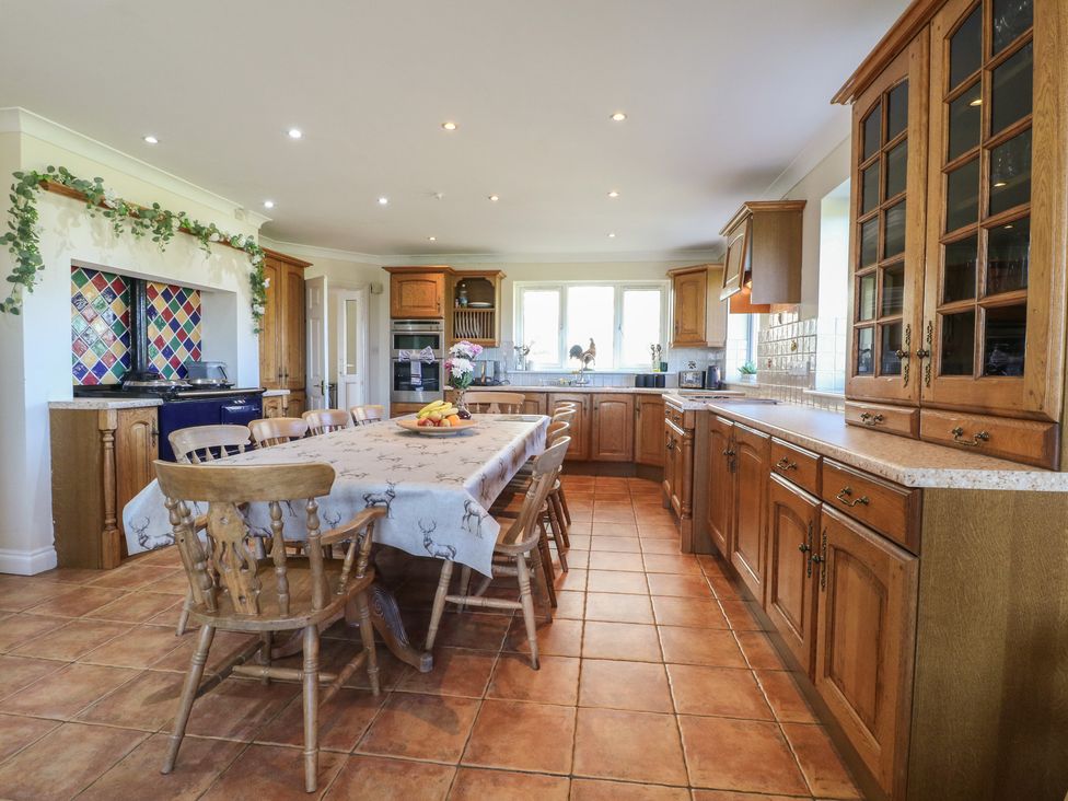 A kitchen with a dining table and chairs at Tixall Manor Farm Tixall near Great Haywood